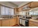 Bright kitchen featuring a double sink, range, and ample counter space for meal preparation at 4428 Ash Ave, Las Vegas, NV 89110