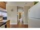 Bright kitchen featuring neutral tones, a refrigerator, and views into the connecting rooms at 4428 Ash Ave, Las Vegas, NV 89110