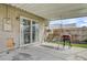 Cozy covered patio with a swing and grill, ideal for relaxing outdoors at 4428 Ash Ave, Las Vegas, NV 89110