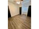 Bedroom with hardwood floors, ceiling fan and dual closets at 5013 Vermont Ave, Las Vegas, NV 89107