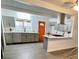 Spacious kitchen with gray cabinets, quartz countertops, stainless steel appliances, and new hardwood floors at 5013 Vermont Ave, Las Vegas, NV 89107