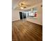 Open living room showing hardwood floors, lots of light and views into the modern kitchen at 5013 Vermont Ave, Las Vegas, NV 89107