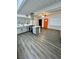Bright and airy living room showing open floor plan with modern kitchen and hardwood floors at 5013 Vermont Ave, Las Vegas, NV 89107