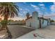 Backyard features a desert landscape, gravel beds, a patio, and a palm tree at 5208 Overland Ave, Las Vegas, NV 89107