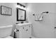 Bathroom features modern vanity with decorative framed mirror at 5208 Overland Ave, Las Vegas, NV 89107