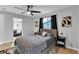Bedroom features window and modern ceiling fan at 5208 Overland Ave, Las Vegas, NV 89107