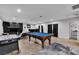 The game room features a pool table, game table, and bar for entertaining at 5208 Overland Ave, Las Vegas, NV 89107