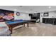 Spacious game room features a pool table, bar area, and unique Las Vegas decor at 5208 Overland Ave, Las Vegas, NV 89107