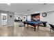 Spacious game room features a pool table, game table, and unique Las Vegas decor at 5208 Overland Ave, Las Vegas, NV 89107