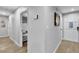 Hallway provides access to the living area and bunk room with hardwood floors at 5208 Overland Ave, Las Vegas, NV 89107