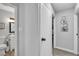 Hallway featuring neutral walls and access to the downstairs powder room at 5208 Overland Ave, Las Vegas, NV 89107