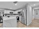 Modern kitchen with stainless steel appliances, quartz countertops, and ample cabinet space at 5208 Overland Ave, Las Vegas, NV 89107
