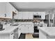 Bright kitchen features stainless appliances, white cabinetry, and decorative backsplash at 5208 Overland Ave, Las Vegas, NV 89107