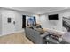Cozy living room with a modern sofa, large TV, and a bright, welcoming atmosphere at 5208 Overland Ave, Las Vegas, NV 89107