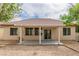 Backyard view showcasing a covered patio and desert-style landscaping at 5319 Farley Feather Ct, North Las Vegas, NV 89031