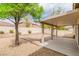Desert landscaped backyard featuring a covered patio and gravel at 5319 Farley Feather Ct, North Las Vegas, NV 89031