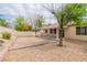 Spacious backyard with desert landscaping and a covered patio area at 5319 Farley Feather Ct, North Las Vegas, NV 89031