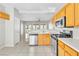 Kitchen features stainless appliances, tile flooring, and wood cabinetry at 5319 Farley Feather Ct, North Las Vegas, NV 89031