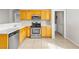 Bright kitchen with stainless appliances and wood cabinets at 5319 Farley Feather Ct, North Las Vegas, NV 89031