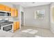 Bright eat-in kitchen with stainless steel appliances and wood cabinetry at 5319 Farley Feather Ct, North Las Vegas, NV 89031