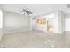 Open-concept living space with tile flooring, neutral walls, and ceiling fan at 5319 Farley Feather Ct, North Las Vegas, NV 89031