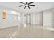 Open-concept living area with tile flooring and neutral walls at 5319 Farley Feather Ct, North Las Vegas, NV 89031