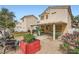 Spacious backyard with lawn, gravel, and patio, great for entertaining in a private setting at 5853 Gentleslope St, Henderson, NV 89011