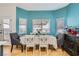 Cozy dining room with table, chairs, and plenty of natural light from the large windows at 5853 Gentleslope St, Henderson, NV 89011