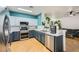 Beautiful kitchen featuring stainless steel appliances, sleek countertops, and ample cabinet space at 5853 Gentleslope St, Henderson, NV 89011
