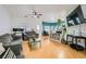 Bright and spacious living room with hardwood floors, comfortable seating, and lots of natural light at 5853 Gentleslope St, Henderson, NV 89011