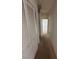 Neutral hallway featuring large closet doors, and access to adjacent rooms at 6158 Calm Breeze Ave # 101, Las Vegas, NV 89108