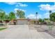 Charming single-story home with a well-maintained front yard, desert landscaping, and a two-car garage at 6408 Shawnee Pl, Las Vegas, NV 89107