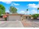 Charming single-story home with a well-maintained front yard, desert landscaping, and a two-car garage at 6408 Shawnee Pl, Las Vegas, NV 89107