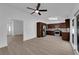 Bright kitchen with stainless steel appliances, wooden cabinets, and sliding glass doors to the outside at 6408 Shawnee Pl, Las Vegas, NV 89107