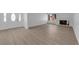 Inviting living room with white brick fireplace, hardwood floors, and modern decor at 6408 Shawnee Pl, Las Vegas, NV 89107
