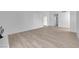 Living room with hardwood floors and white walls, including a fireplace at 6408 Shawnee Pl, Las Vegas, NV 89107