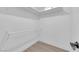Walk-in closet with white walls, shelving and light wood floors at 6408 Shawnee Pl, Las Vegas, NV 89107