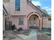 Charming two-story home with a unique archway entrance and a well-maintained front yard landscape at 6561 Avon Ct, Las Vegas, NV 89108