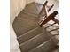 Stylish wooden staircase leading to the upper level of the home at 6561 Avon Ct, Las Vegas, NV 89108