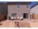 Backyard space with patio, outdoor seating, and block fire pit, creating an entertainment-ready space at 6631 Frosted Harvest Ave, Las Vegas, NV 89108