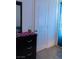 Bedroom with black dresser, a framed mirror, and a cozy, inviting atmosphere at 6631 Frosted Harvest Ave, Las Vegas, NV 89108