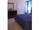 Cozy bedroom featuring neutral paint, plush carpet, and a comfortable bed at 6631 Frosted Harvest Ave, Las Vegas, NV 89108