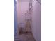 Closet with a minimalist design, illuminated by a lamp and equipped with storage solutions at 6631 Frosted Harvest Ave, Las Vegas, NV 89108