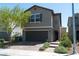 Charming two-story home features a front yard with desert landscaping and an attached two-car garage at 6631 Frosted Harvest Ave, Las Vegas, NV 89108