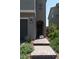 View of the house's front door with a short brick pathway and desert landscaping at 6631 Frosted Harvest Ave, Las Vegas, NV 89108