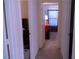 Hallway leads to bedrooms, each uniquely decorated for a cozy and inviting atmosphere at 6631 Frosted Harvest Ave, Las Vegas, NV 89108