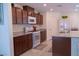 Kitchen features stainless steel appliances, granite countertops, and abundant cabinetry at 6631 Frosted Harvest Ave, Las Vegas, NV 89108