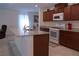 Bright kitchen with granite countertops, stainless steel appliances, island with sink, and lots of cabinet space at 6631 Frosted Harvest Ave, Las Vegas, NV 89108