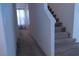Carpeted stairway leading upstairs, bathed in soft, natural light at 6631 Frosted Harvest Ave, Las Vegas, NV 89108