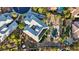 An aerial view shows a house with solar panels, landscaping, and a backyard pool with a waterfall feature at 6907 Kelp Ledge Ct, Las Vegas, NV 89131